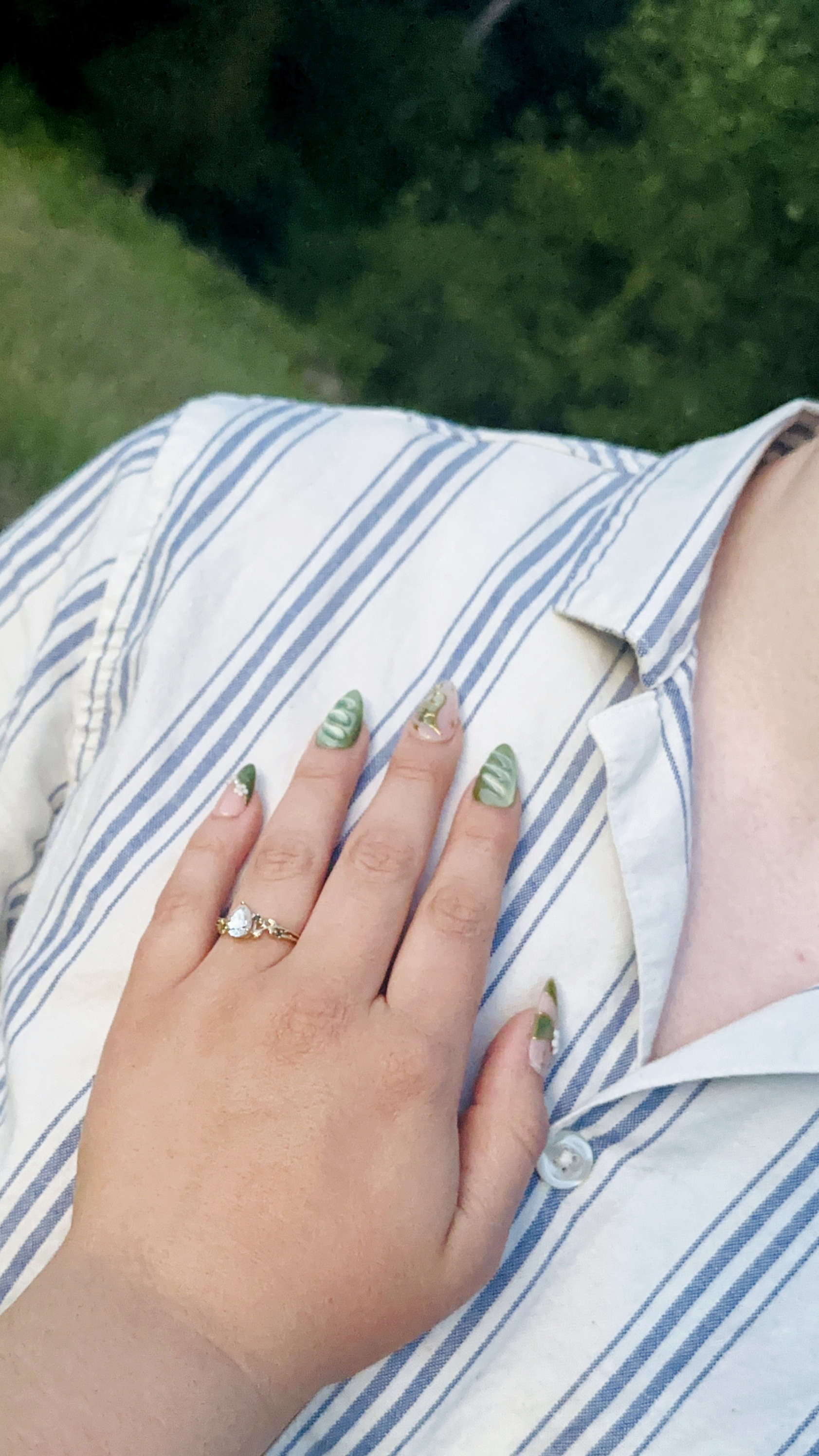 Isabella's hand with her engagement ring